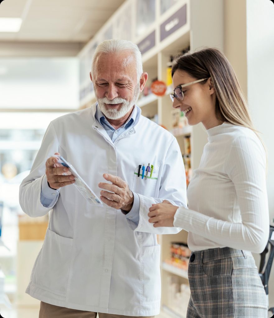 A pharmacist explaining how to take a medication to a customer